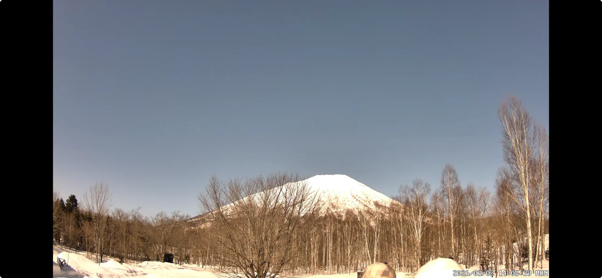 Snow-covered Mt. Yotei and winter campsite scenery